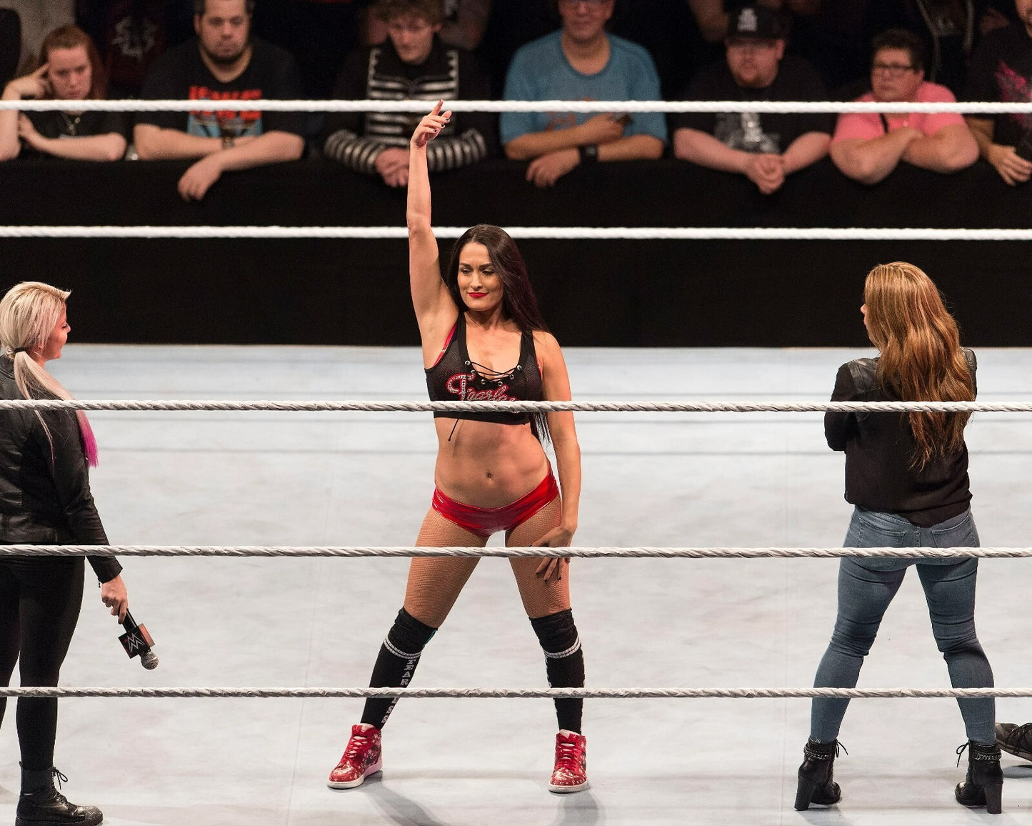 Nikki Bella holding championship belt in the ring canvas wall art