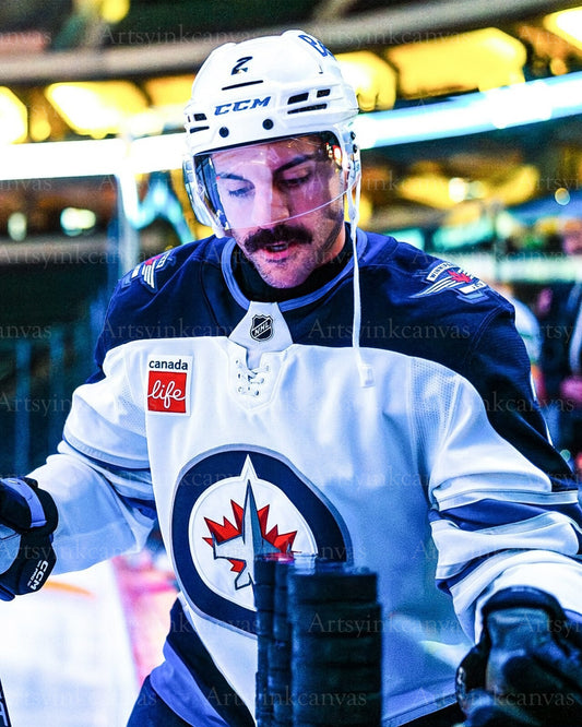 Dylan DeMelo hitting warmup pucks Winnipeg Jets canvas wall art