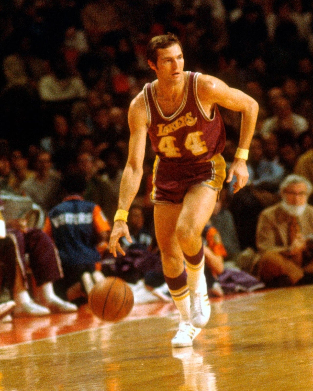 Jerry West dribbling canvas wall art