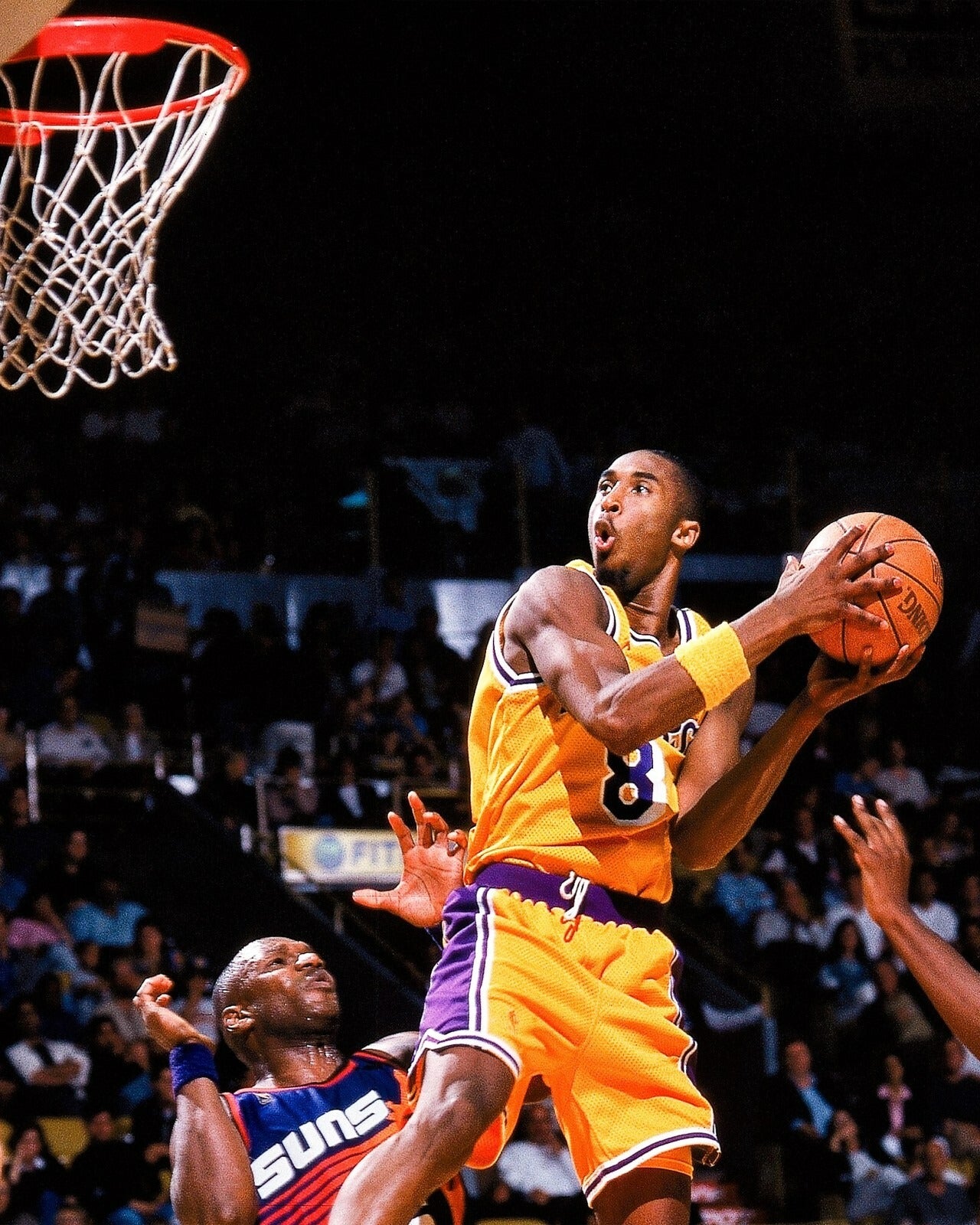 Kobe Bryant going up for a layup canvas wall art