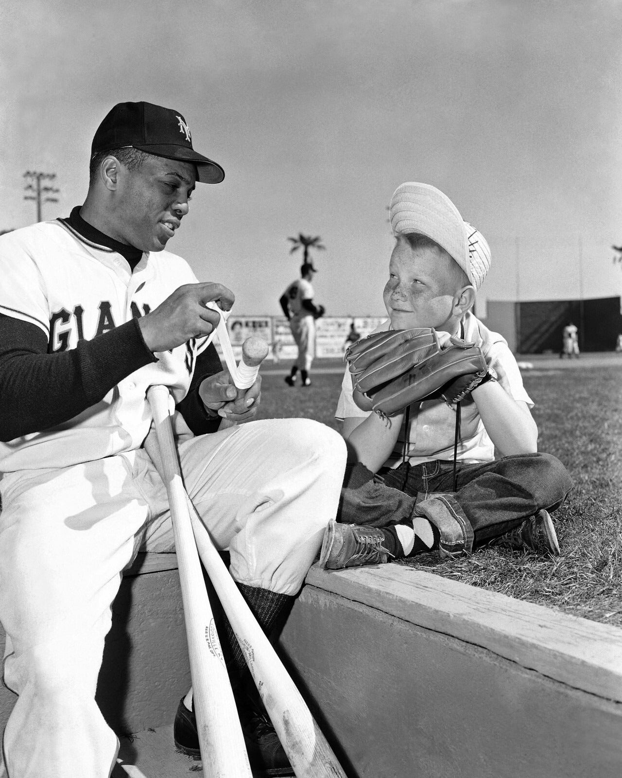 Willie Mays inspiring a young fan canvas wall art