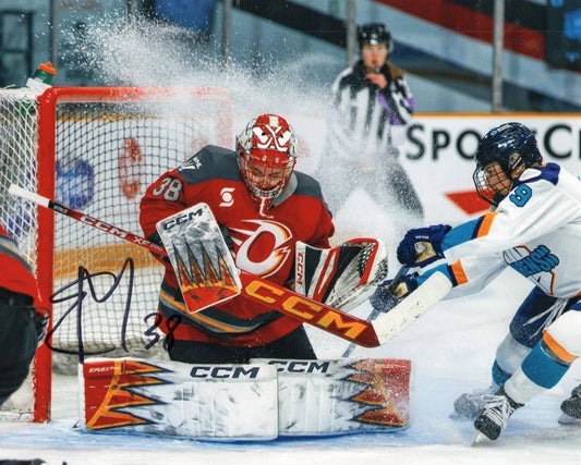 An autographed sports photo print of an NHL hockey game, featuring a goalie in a red jersey blocking a shot from an opponent in a white jersey. The photo is signed in black ink across the lower-left area.